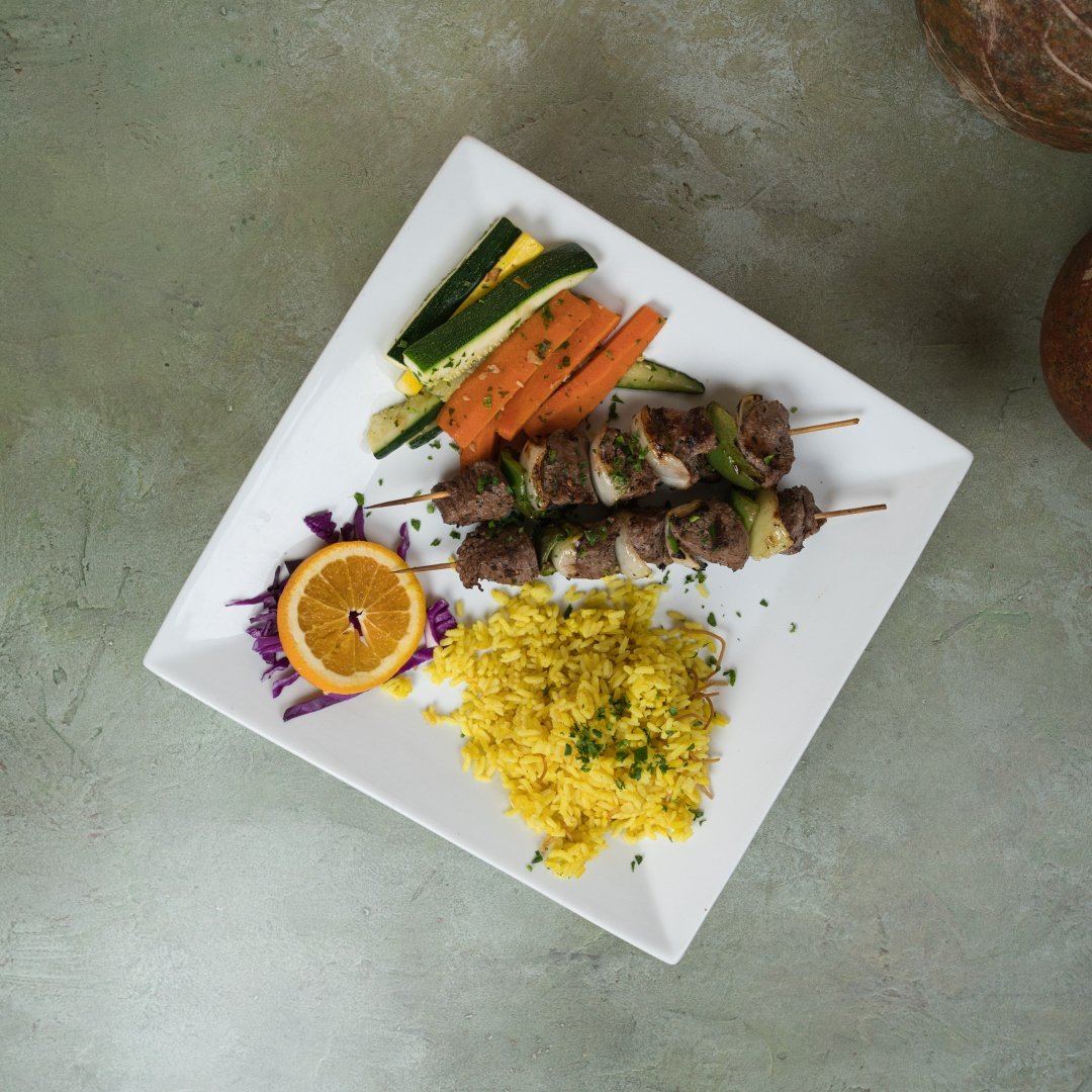 Beef kebobs plate grilled over open flame at Phoenician Garden Fresno