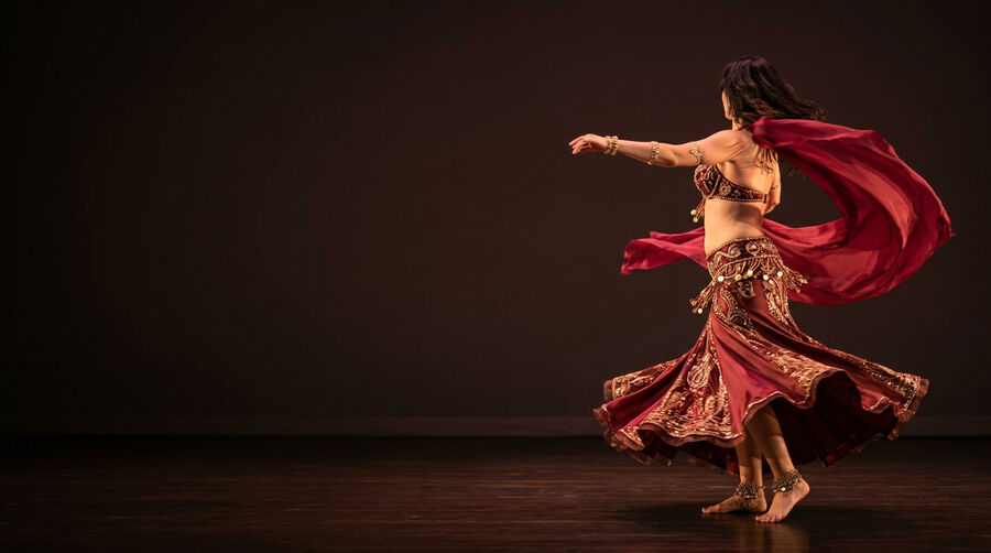 Professional belly dancer performing at Phoenician Garden Mediterranean restaurant in Fresno