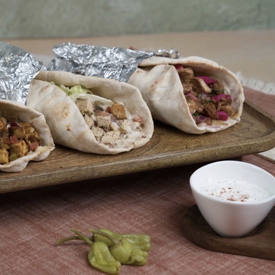 Assorted Mediterranean wraps arranged for a medical office lunch delivery