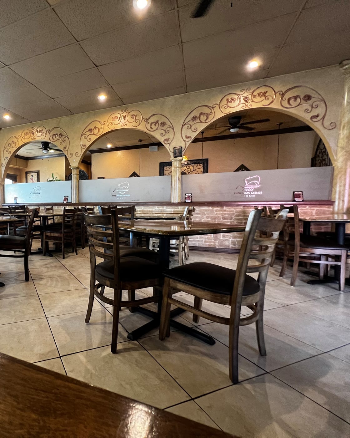 Phoenician Garden dining room with arched alcoves and warm pendant lamps in Fresno