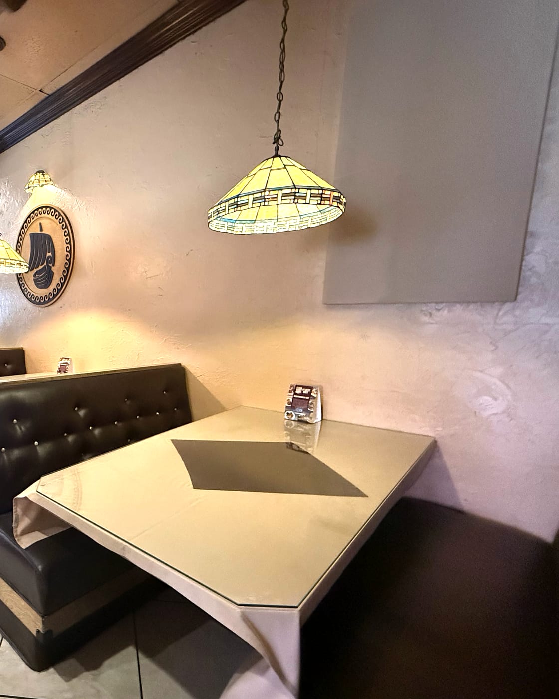 Phoenician Garden dining room booth and pendant lamp in Fresno