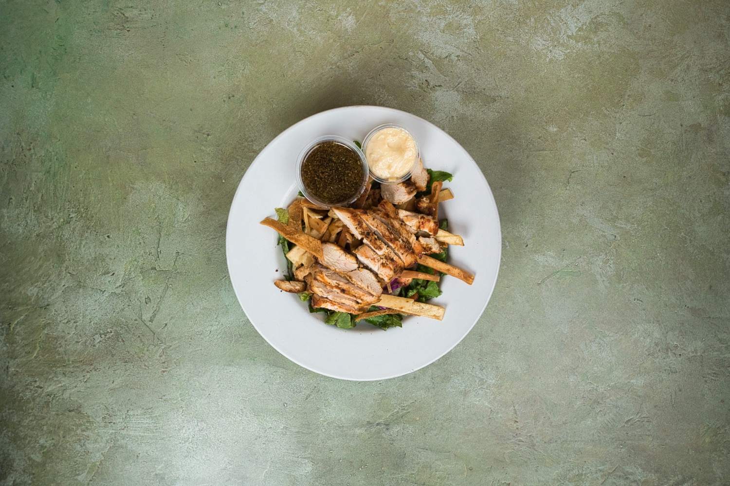 Fattoush salad with crispy pita chips and fresh vegetables at Phoenician Garden Mediterranean Restaurant in Fresno