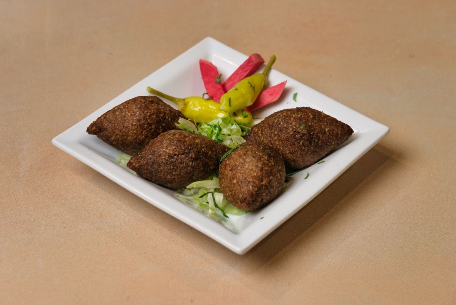 Kibbeh with ground meat and pine nuts at Phoenician Garden Fresno