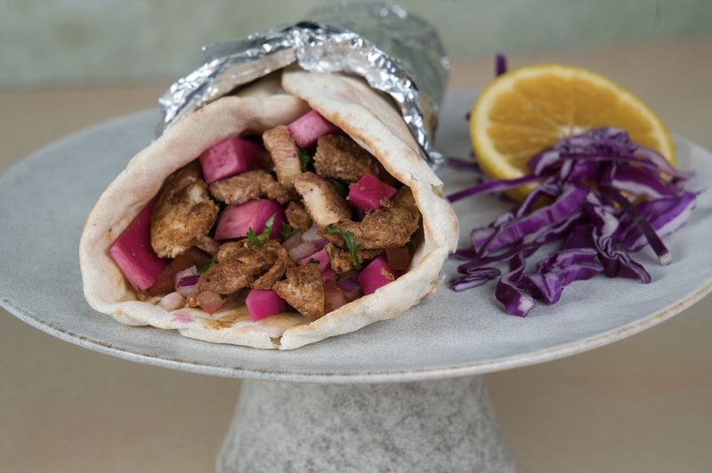 Shawarma wrap with garlic sauce and vegetables at Phoenician Garden Fresno