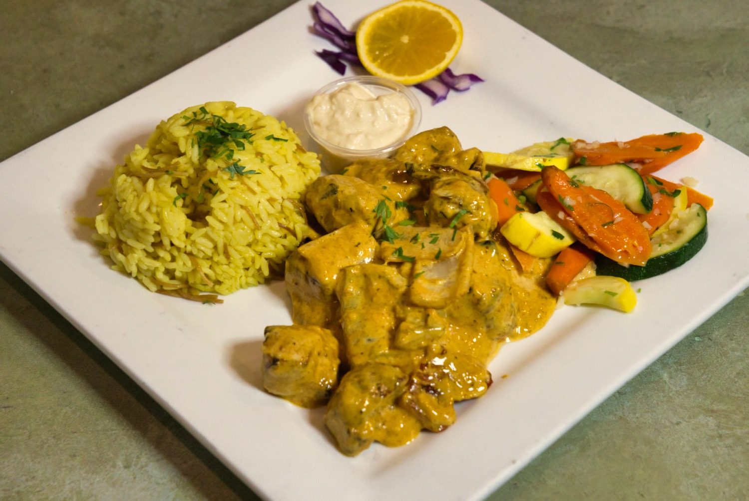 Spicy chicken shawarma plate ready to order from Phoenician Garden Fresno