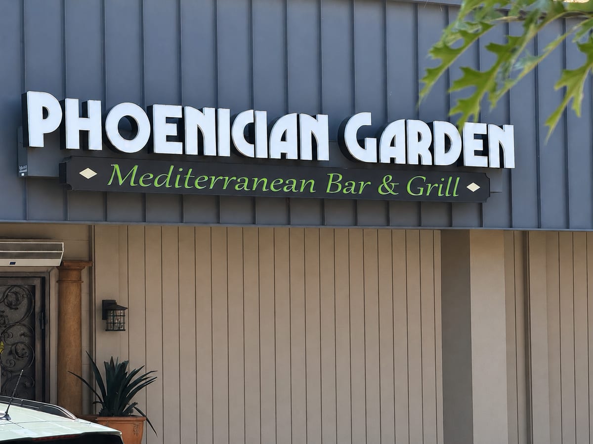 Phoenician Garden Mediterranean Bar and Grill storefront sign on E Herndon Ave in Fresno